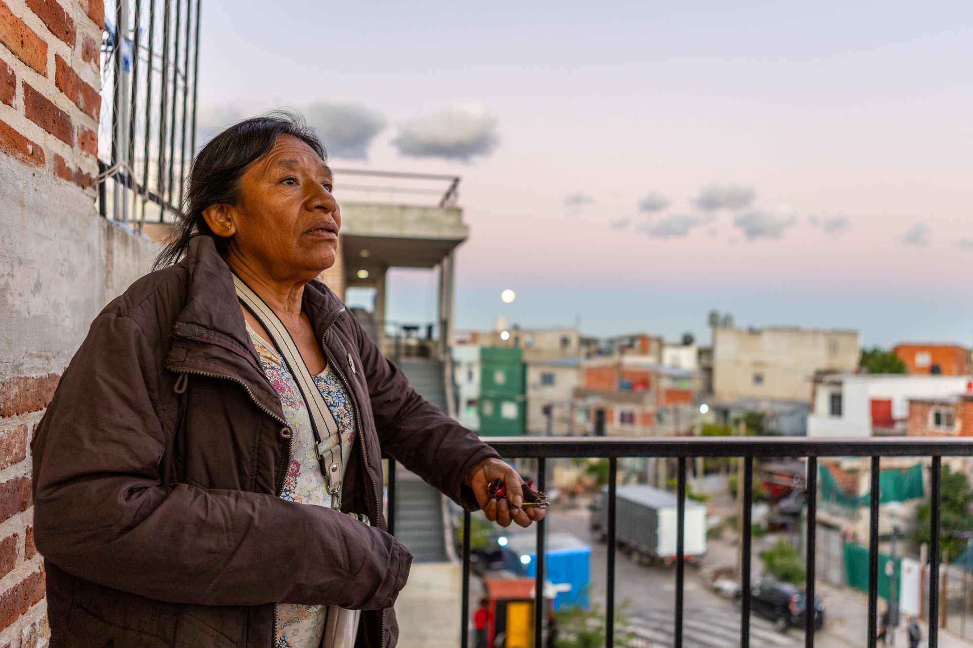 Image of a woman beside a railing