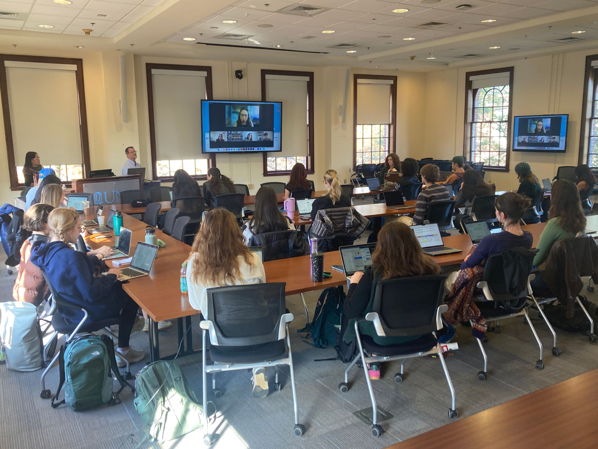 A group of students on a zoom call in Carroll Hall.